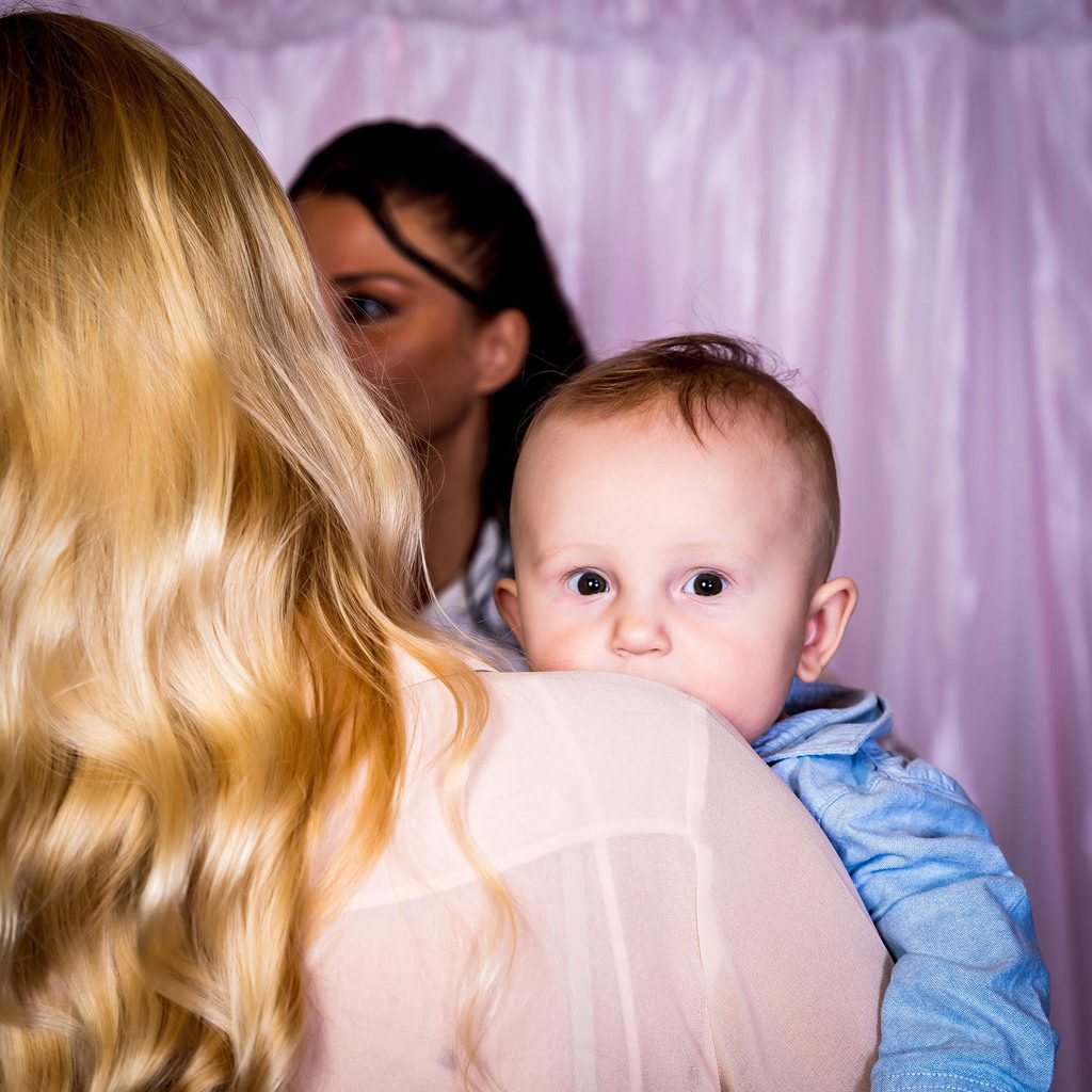 Little boy is looking at the camera at the birthday party photoshoot.