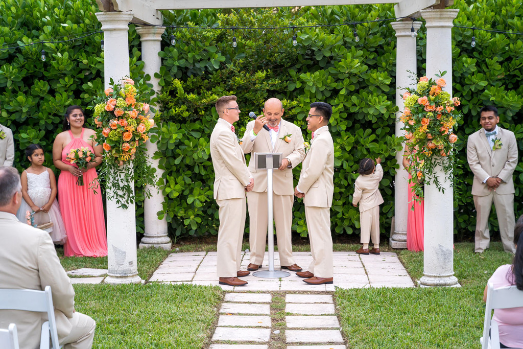 Happy wedding ceremony photography for gay couple.